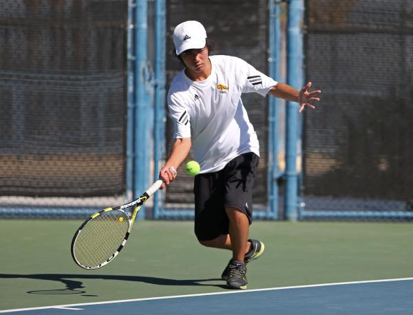 Clark junior Andrew Lim returns the ball during a Division I-A state championship match agai ...