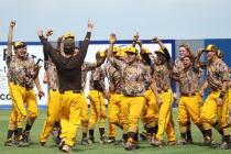 Bonanza coach Derek Stafford, on left in brown shirt, joins his players to celebrate Friday ...
