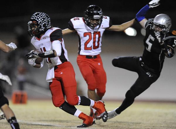 Las Vegas’ Justin Taitague (20) throws a block against Green Valley’s Micah Klor ...