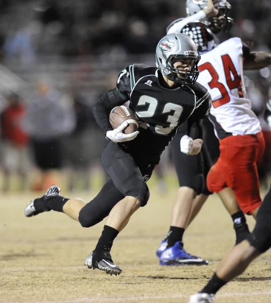 Green Valley’s Albert Lake carries the ball in the second quarter.
