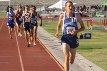 Centennial Bulldogs 1600 meter runner Nick Hartle already has a large lead over his competit ...