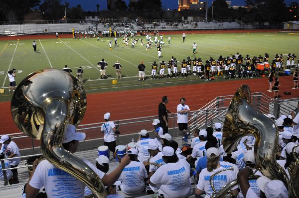 Members of Clark’s band watch the Chargers as they host Rancho in the season opener on ...