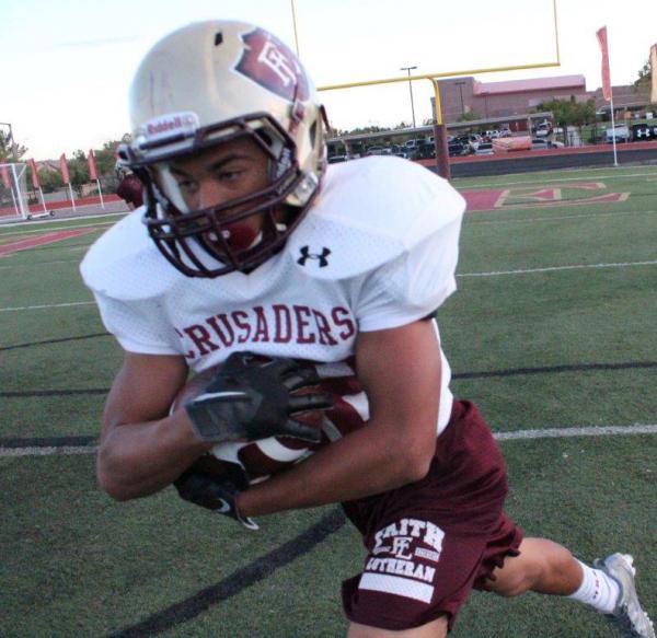 Faith Lutheran running back Keenan Smith carries the ball at a recent practice.