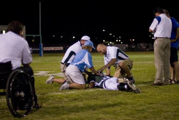 Green Valley linebacker LaQuan Phillips is examined by athletic trainers in this Sept. 5, 20 ...