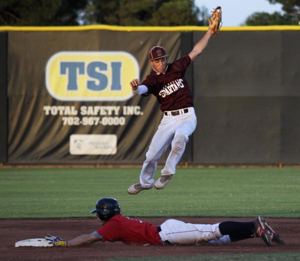 Liberty’s Preston Pavlica steals second as Cimarron-Memorial’s Logan Bottrell le ...