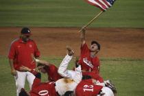 Liberty players celebrate their win over Cimarron-Memorial in the American Legion state cham ...