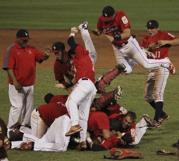 Liberty’s baseball team celebrates Saturday after clinching its second straight American L ...