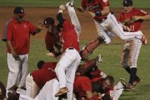 Liberty’s baseball team celebrates Saturday after clinching its second straight American L ...