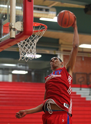 Valley High School basketball senior forward Daniel Young makes a dunk during practice at th ...