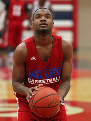 Valley High School basketball senior guard Ryan Johnson goes for a shot during practice at t ...