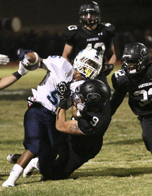 Canyon Springs Pioneers football player Donnel Pumphrey (5) is sacked by Palo Verde Panthers ...