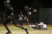 Palo Verde Panthers football player Ryan Beaulieu (24) sidesteps Canyon Springs Pioneers&#82 ...