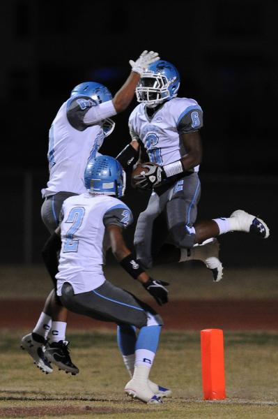 Centennial’s Lantz Worthington (6) celebrates with his teammates after scoring a touch ...
