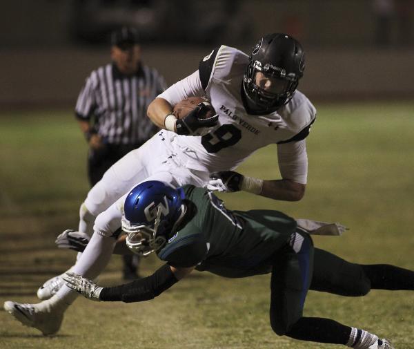 Green Valley’s Jacob Rivero (6) makes an open-field tackle against Palo Verde’s ...