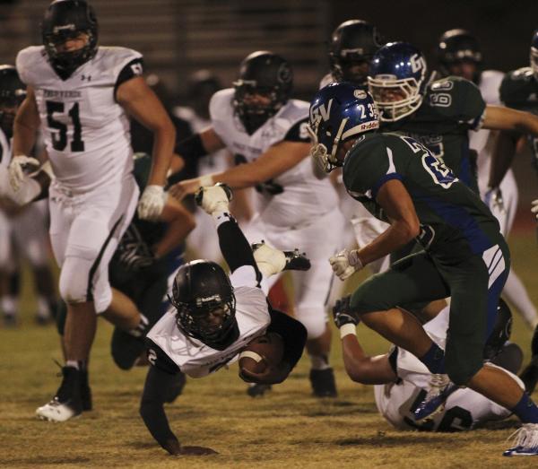 Palo Verde’s Hykeem Massey (2) dives for a first down in front of Green Valley’s ...