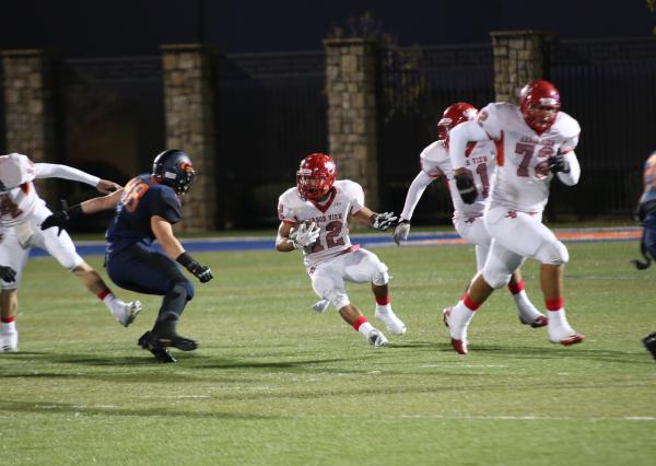 Arbor View’s Gage Motl (12) evades a tackler on Friday during the Sunset Region semifi ...