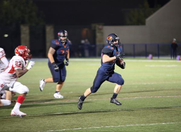 Bishop Gorman running back Jonathan Shumaker (33) carrie the ball on Friday. Shumaker had 13 ...