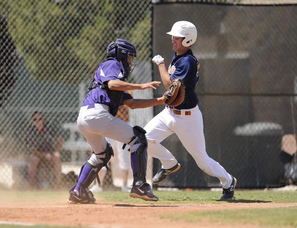 Durango catcher Oscar Cardenas applies the tag to Legacy’s Joey Wright.