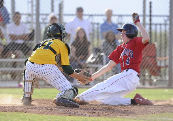 Rancho catcher Zach Barnhart tags out Liberty’s James Martz trying to score in the sec ...