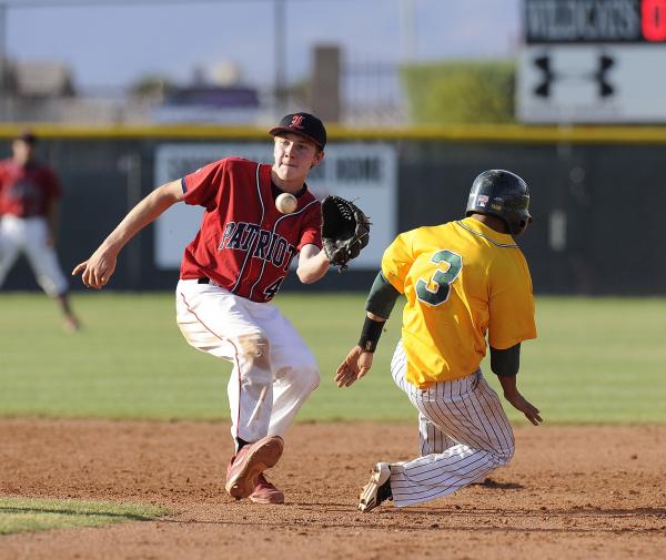 Liberty shortstop James Martz tags out Rancho’s Bryce Harrell trying to steal second i ...