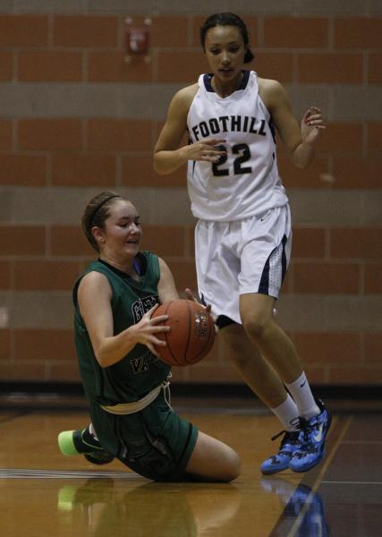 Green Valley’s Brooke Haney, left, dives for the ball in front of Foothill’s Mik ...