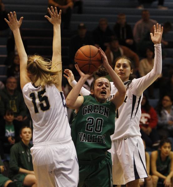 Foothill’s Nicole Benson, left, and Taylor Turney surround Green Valley’s Rianna ...