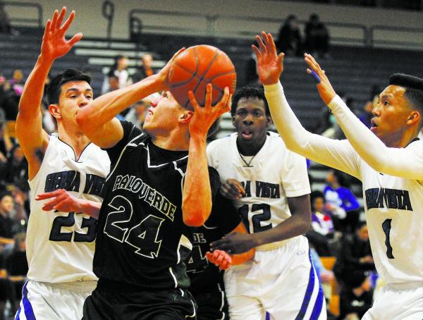 Chaparral’s Maharie Trotter (12), center, takes a shot over Virgin Valley defenders on ...