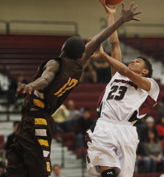 Desert Oasis’ Rodrick Moore (23) shoots over Bonanza’s D.J. Fletcher (12) on Fri ...