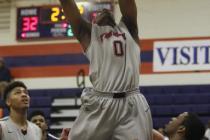 Findlay Prep’s Horace Spencer (0) grabs a rebound on Saturday against Impact Academy. ...