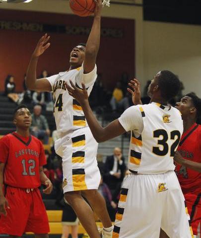 Clark’s Diontae Jones (24) grabs a rebound in front of Las Vegas’ Devon Colley ( ...