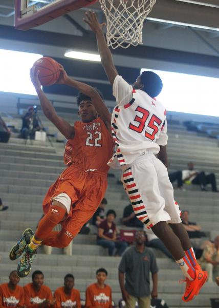 Legacy’s Shakir Arrey (22) goes for the basket against Chaparral’s Tyree McNeal ...