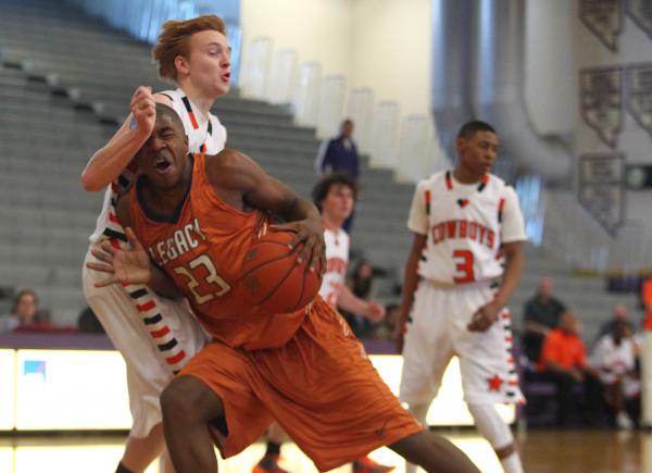 Legacy junior forward Deshaun Hilliard drives against Chaparral junior forward Josh Allen du ...