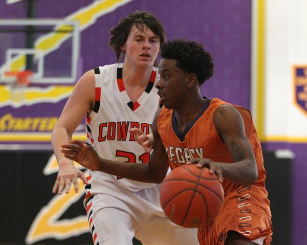 Chaparral’s Tyree McNeal (35), left, takes a shot over Virgin Valley’s Garrett L ...