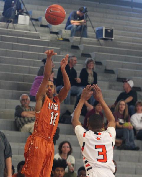Legacy’s Jalen Glover (20) shoots a 3-pointer over Chaparral’s Marc Silas (3) on ...