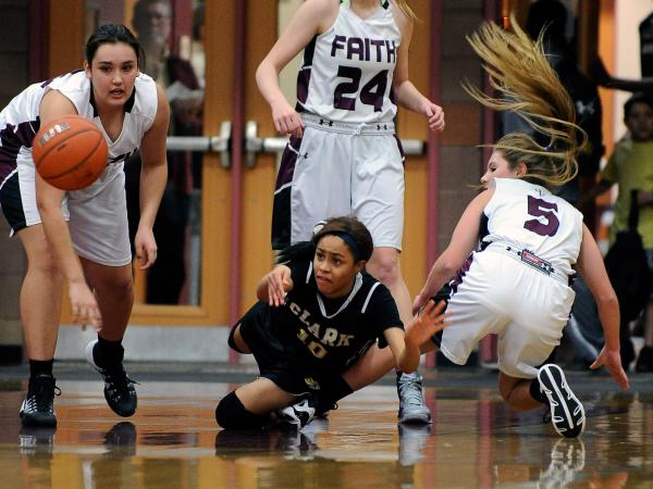 Clark’s Johnice Bland (10) passes the ball as she is surrounded by Faith Lutheran&#821 ...