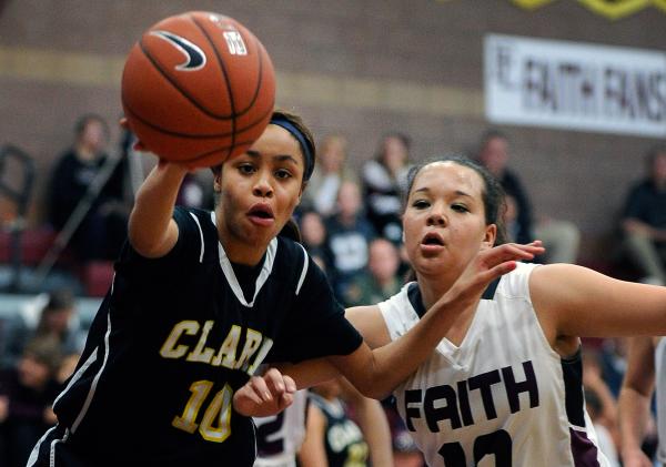 Clark’s Johnice Bland, left, and Faith Lutheran’s Kim Munro chase a loose ball o ...