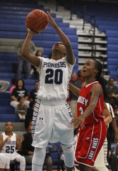 Canyon Springs’ Alexia Thrower (20) shoots over Alaihya Williams (3) on Tuesday night.