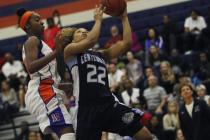 Centennial’s Teirra Hicks (22) drives to the hoop against Bishop Gorman’s Maddis ...