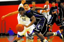 Basic’s Antraye Johnson (2) steals the ball from Graves County’s Andrew Smith (1 ...