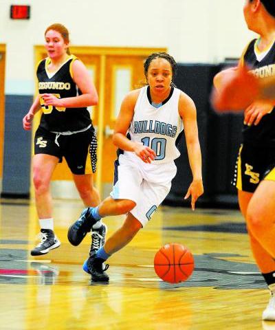 Centennial guard Tramina Jordan weaves between El Segundo (Calif.) defenders on Friday. Jord ...