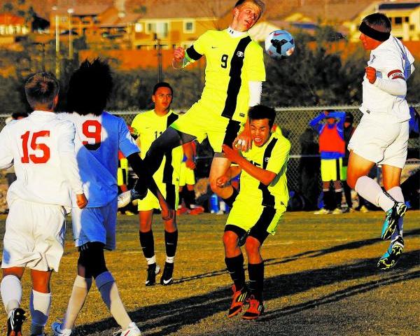 Green Valley’s Kade Kochevar (9) attempts a header against Liberty on Tuesday in the S ...