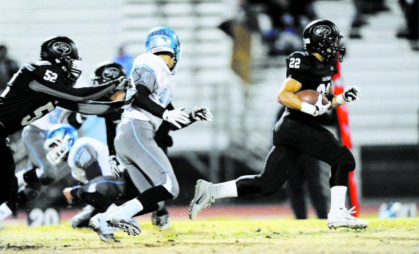 Palo Verde’s Calvin Beaulieu (22) runs away from the Centennial defense.