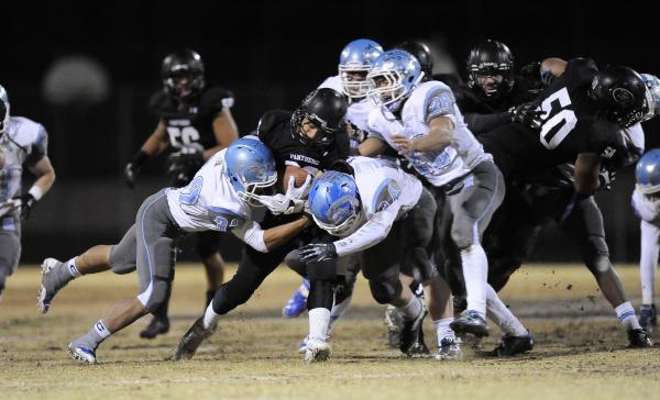 Palo Verde’s Calvin Beaulieu looks for running room against Centennial’s defense ...