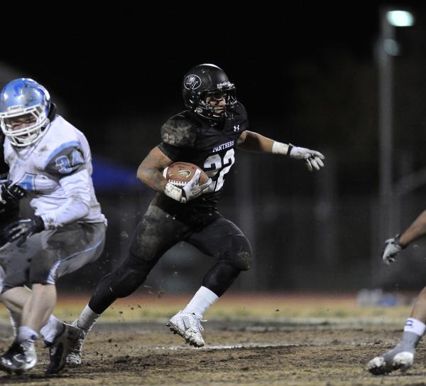 Palo Verde’s Calvin Beaulieu (22) runs by Centennial’s Hunter Brown