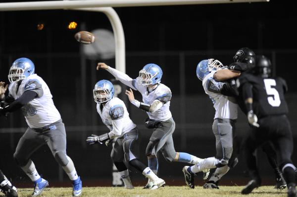 Centennial quarterback Coll Thomson (7) throws a pass