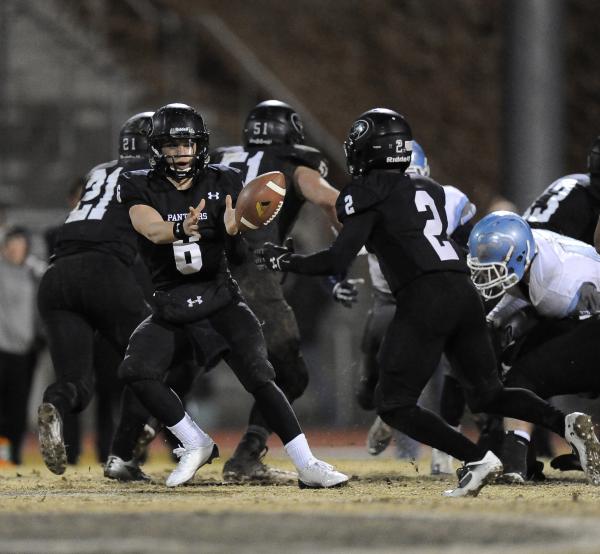 Palo Verde quarterback Parker Rost (6) tosses the ball to Hykeem Massey.