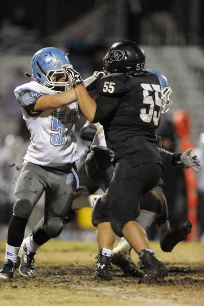 Palo Verde’s Nick Ortega (55) confronts Centennial’s Anthony Parnell.