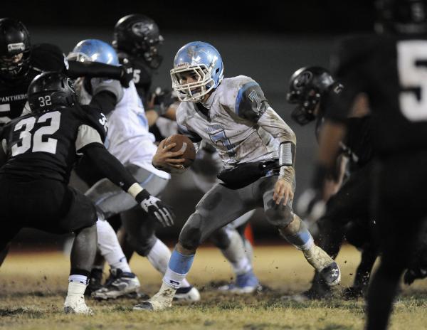 Centennial’s Coll Thomson (7) looks for room against Palo Verde’s Chauntez Thoma ...