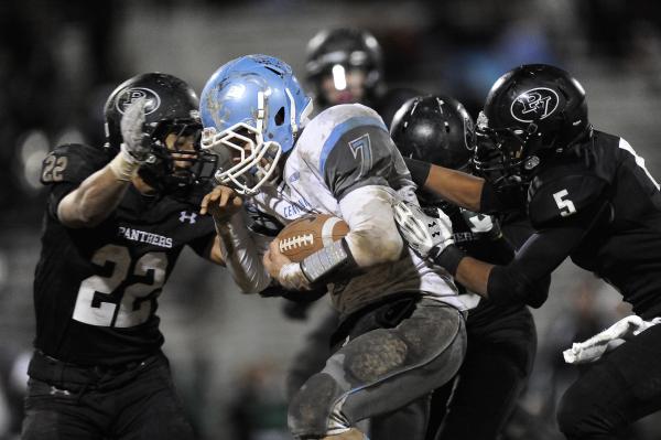 Centennial’s Coll Thomson (7) is surrounded by Palo Verde’s Calvin Beaulieu (22) ...