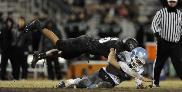 Palo Verde’s Josh Hamilton flies through the air to hit Centennial’s Coll Thomso ...